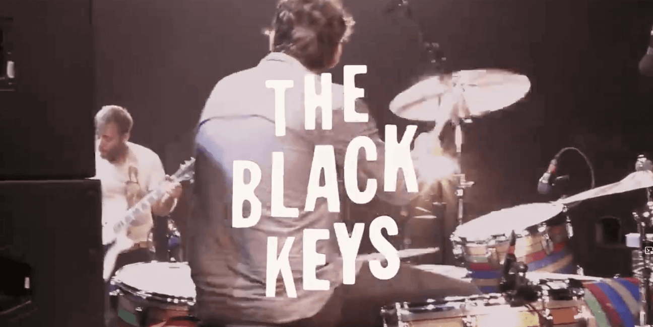 The Black Keys performing live on stage with drummer and guitarist at music festival